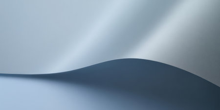 Draped fabric creates soft waves, showcasing a blend of light and shadow. The smooth texture offers a calming and serene atmosphere, highlighting elegant curves.の素材