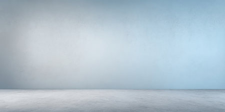 A blank space features a smooth blue wall and a gray floor. The room has no furniture or decorations, creating an open area with a simple visual appeal.の素材