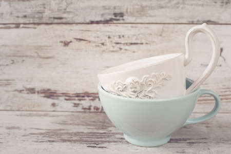 Simple rustic white and blue crockery, empty dishes. Two large bowls each other. Wooden background, vintage, shabby chic, copy sraceの写真素材