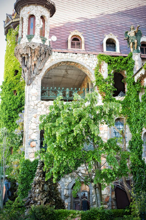 Beautiful old fairy-tale castle near Burgas, Bulgaria. Walls of the castle, green flower gardenのeditorial素材
