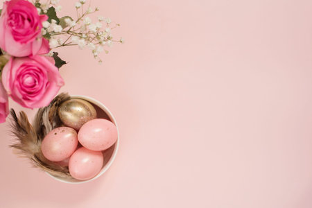Pink and Gold Easter Eggs. Pastel Easter Concept with Eggs, Flowers and Feathers. Punchy Pastels
