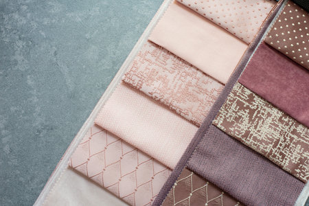 Fabric samples on the table. The designer workplace concept. Freelance fashion comfortable...