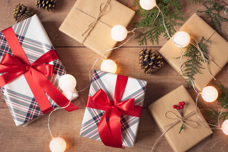 Christmas Background. Top View Of Christmas Boxes And Lights In Craft And Red Stripe Paper Decorated...