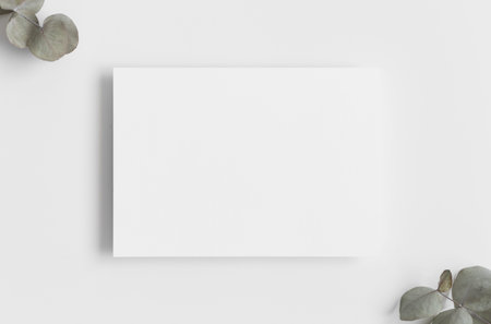 Invitation white card mockup with eucalyptus branches. 5x7 ratio, similar to A6, A5.v