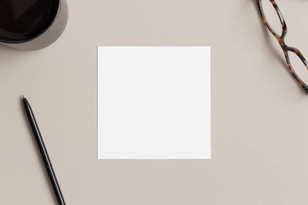 Invitation square card mockup with workspace accessories.の写真素材