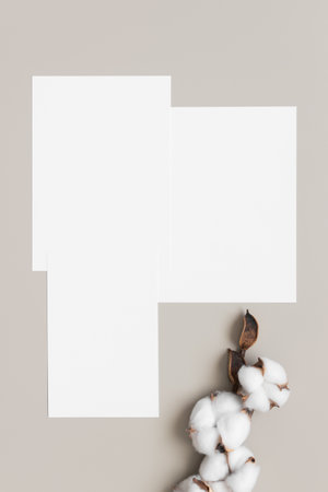 Wedding invitation stationery mockup with a cotton branch decoration.の写真素材
