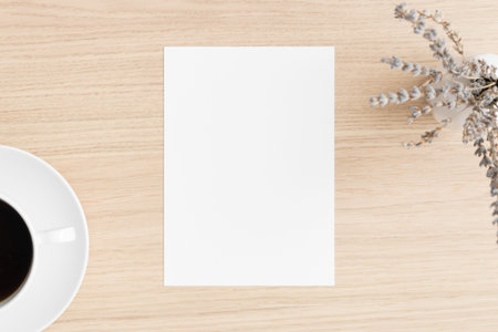 White invitation card mockup with lavender and a cup of coffee on the wooden table. 5x7 ratio,...