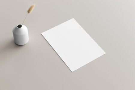 White invitation card mockup with a lagurus on a beige table. 5x7 ratio, similar to A6, A5.の写真素材