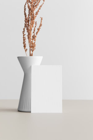 White business card mockup 85x55mm with a dried flower decoration on a beige table.の写真素材
