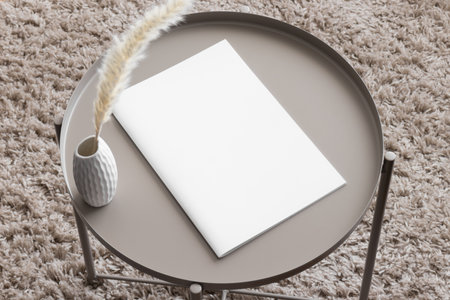 Magazine mockup with a pampas on the beige table.の写真素材