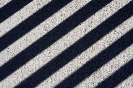 cool shadow pattern cast on grey concrete nice backgroundの写真素材