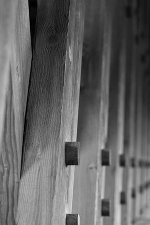 the lumber used to build an covered bridge close up of the detail, then fading to blurの写真素材
