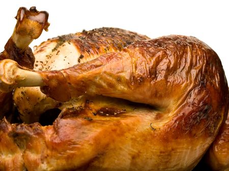 thanksgiving turkey hot and fresh out of the oven close up over whiteの写真素材