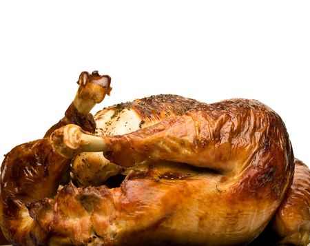 thanksgiving turkey hot and fresh out of the oven close up over whiteの写真素材
