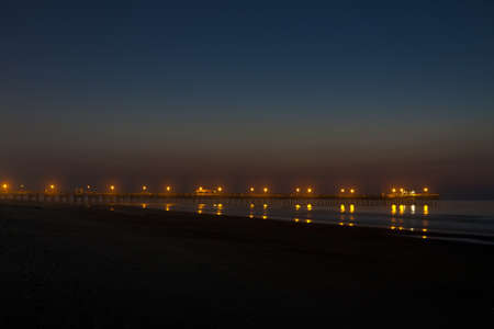 dawn at pierの写真素材
