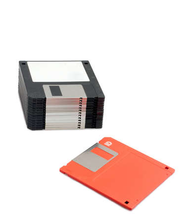 stack of black floppy disks and one redの写真素材