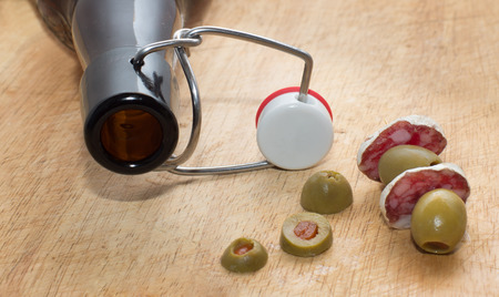 Beer bottle and snacksの写真素材