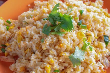 fried rice with crab and vegetable on plateの写真素材