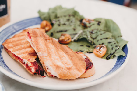Deliciously fresh classic club sandwich. The sandwich is cut into two parts. Homemade sandwich with...