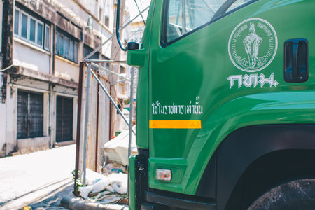 BANGKOK, THAILAND. SEPTEMBER 1, 2019: the green garbage truck carries the garbage from the villages.のeditorial素材