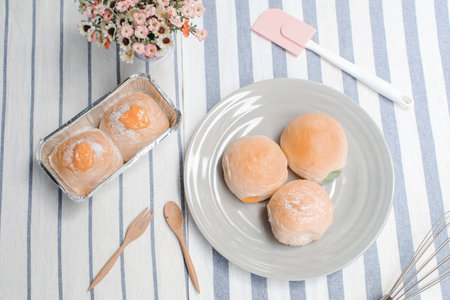 Close up various fresh baked buns/bread in market  with sweetened condensed milk, Thai tea custard...