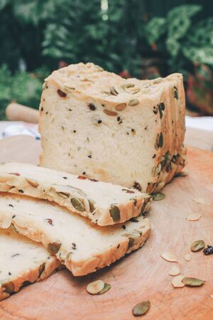 Homemade High fiber natural health food Sliced rye bread on cutting board. Whole grain rye bread with seedsの写真素材