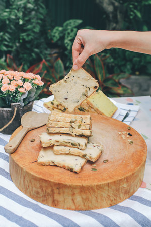male hand picking up a slice of rye bread Homemade High fiber natural health food Sliced rye bread...