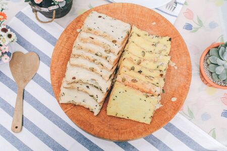 Homemade High fiber natural health food Sliced rye bread on cutting board. Whole grain rye bread with seedsの写真素材