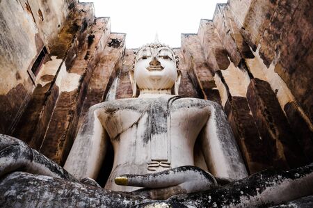 Ruins temple Sukothai historical park,  Thailand, the body to head part of the big buddha image at Wat Sri Chum in Sukhothai.の写真素材