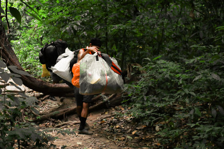 Sukhothai/Thailand - 31 October 2019 : Mountain porter on Khao Luang mountain in Ramkhamhaeng National Park, Sukhothai province Thailandのeditorial素材
