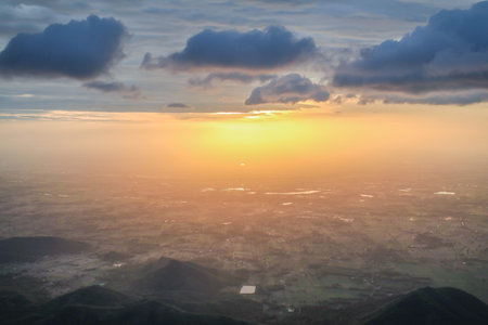 Aerial view of mountains with cloud cover mountain at sunrise and blue sky on Khao Luang mountain in Ramkhamhaeng National Park,Sukhothai province Thailand Rocky cliff with beautiful Viewの写真素材