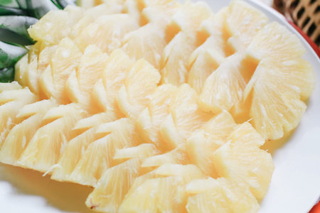 slices of pineapple on bamboo basket and burlap served on table top tropical fruit