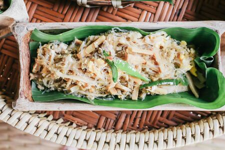Set of local food at Na Ton Chan homestay,fried fish with tomato,corn,cucumber and boil vegetable  Si Satchanalai district, Sukhothai Province ,Thailand.on Khantoke traditionally meal set popularの写真素材