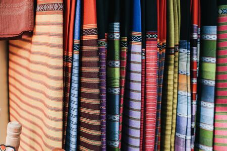 Traditional Thai silk cloth in fashion store.Beautiful background Household handicrafts of Thai silkの写真素材