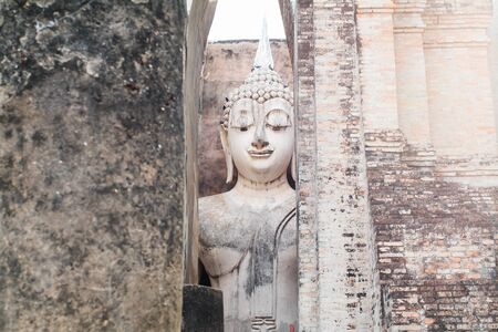 Ruins temple Sukhothai historical park, Thailand, the body to head part of the big buddha image at Wat Sri Chum in Sukhothai.の写真素材