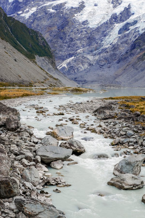 The icy water of the River and the stony coast  Canyon. The wild river stream has been working on...