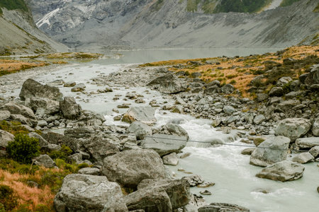 The icy water of the River and the stony coast  Canyon. The wild river stream has been working on...