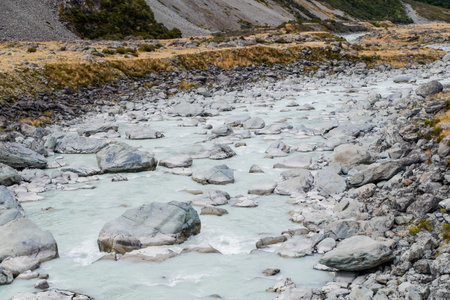 The icy water of the River and the stony coast  Canyon. The wild river stream has been working on...