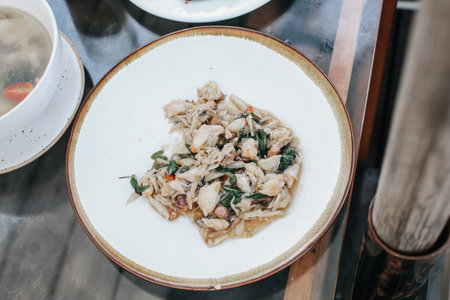 Black Pepper meat Crab-Top view of crab meat stir fried with black pepper served on white plateの写真素材