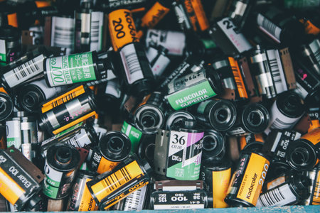 BANGKOK, THAILAND - MARCH 20, 2020: Some various brand of used film rolls in wood box, seems to be obsoleted since digital camera has come into market but still be favorite in some group.のeditorial素材
