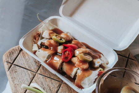 Crab fresh spring rolls with sweet sauce,crab,chili,cucumber,egg,bean sprouts,spring onion wrap with roti dough sheet in white box concept Vietnam food in Thai.の写真素材