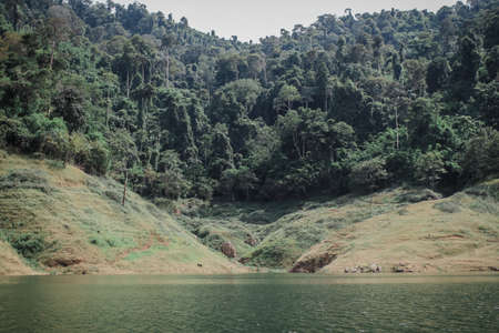 Panoramic view of beautiful lake and mountain landscape fresh green valley at Khun Dan Prakan Chon Dam Nakhon Nayok Thailand.Deep forest lake shore in rainy day.の写真素材