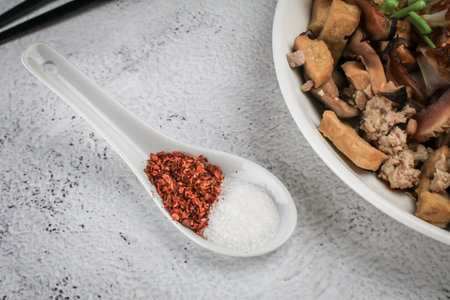 Close up Spices Seasoning chili powder and sugar in white spoon.Flavoring ingredients or food...