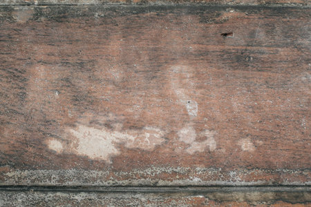 Old vintage dirty pine plank wooden floor with stains of paint.Rustic dark grunge wood texture and...
