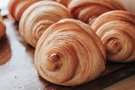 Warm Fresh Buttery Croissants and Rolls. French and American Croissants and Baked Pastries are...