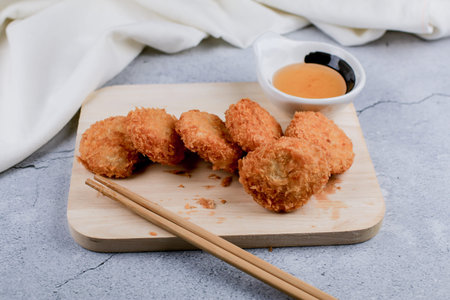 Shrimp pancake with dipping sweet sauce on wooden cutting broad. Food Asian style Served with Sweet...