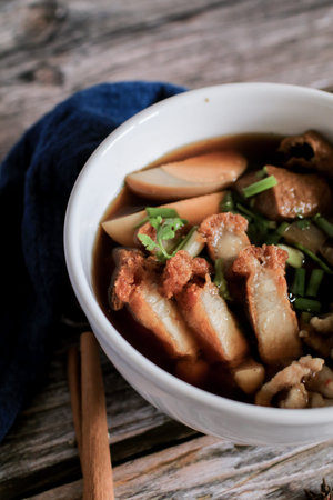 Chinese roll noodles soup with crispy pork and egg , noodle. Thai language called Kuay Jab and...