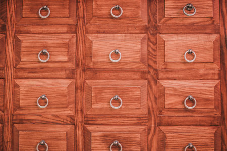 Closeup of vintage wooden furniture with small drawers - storage and sorting concept or just retro background.の写真素材