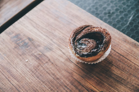 Kouign amann: Croissants on wooden background in restaurant, breakfast pastries, french pastries.
