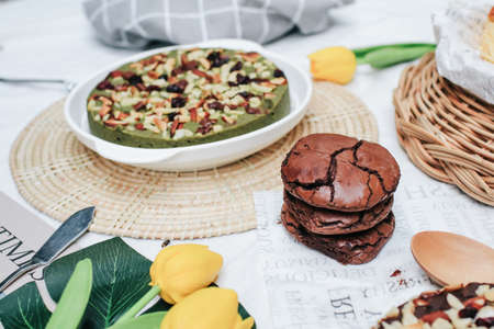 Chocolate brownie cookies. Baked Creamy Dark chocolate chip cookies on dark texture background. Morning table. Copy space.の写真素材
